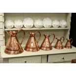 Set of Five Antique Copper Graduating Jugs