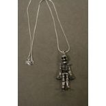 A silver articulated skeleton pendant necklace