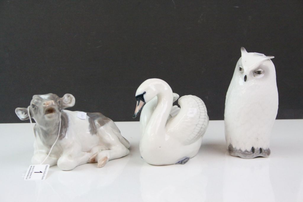 Three Royal Copenhagen ceramic Animals to include; Owl number 155, Cow numbered 082, Swan numbered