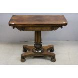 William IV Mahogany Fold-Over Card Table raised on a reeded column and leaf carved support with a