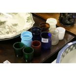 10 vintage glass tea lights of various colours