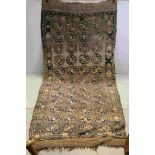 19thcentury Afghan Nomad Rug with old label to reverse, 295cms x 123cms