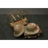 Two vintage French military helmets and a small Attache case and a budgie cage