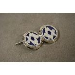 A pair of silver cufflinks with Masonic image