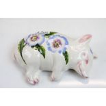 Wemyss ceramic model of a Pig lying on its side with hand painted Floral decoration, marked "Exon.
