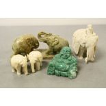 Three early 20th Century carved Ivory Elephants, one with seated figure on top, green Hardstone