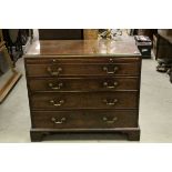 George III Mahogany Chest of Four Long Drawers and Brushing Slide raised on Bracket Feet, 97cms wide