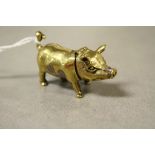 A brass cased pig vesta case