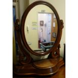 Mahogany dressing table mirror with oval mirror to the top, above a small platform containing a lift