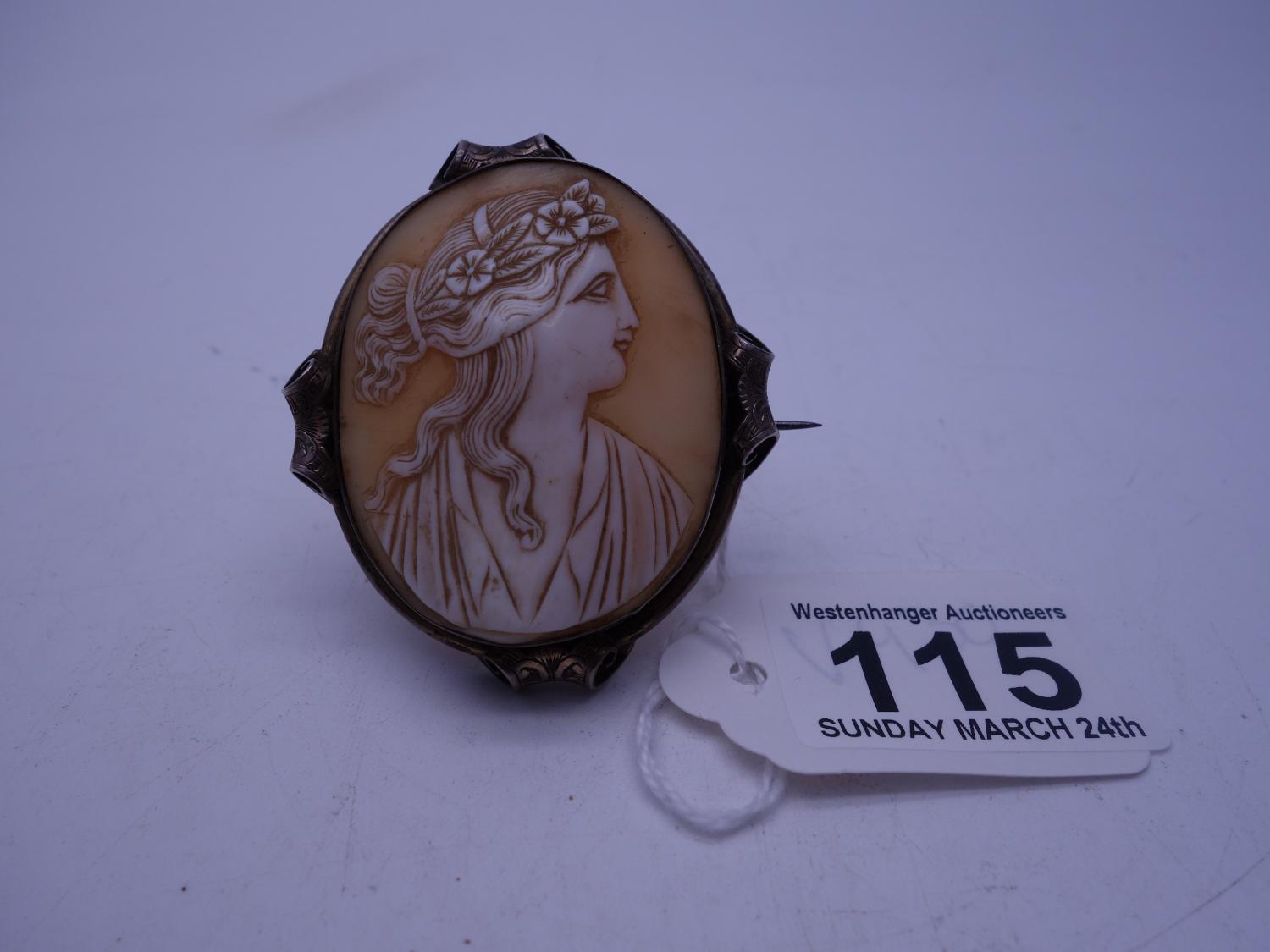 Early 20th century oval Cameo brooch 2.1/4" tall 2" wide, depicting a Grecian Lady set in silver,