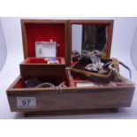 Musical jewellery box with 4 tier enclosed contents of costume jewellery and watches, mainly