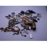 Box containing various costume jewellery including silver items, coins, and decorative bracelets,