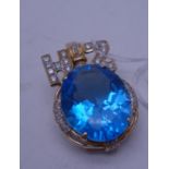 Superb brooch set with a large London Topaz to the centre the stone measures 1" long, set in 14ct