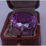 18ct white gold pendant set with diamonds and large amethyst coloured stone, the stone measures 1.