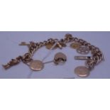 Antique gold charm bracelet with heart shaped locket and safety chain attachment, 43 grams 8" long