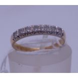 18ct gold half hoop diamond ring size K the top set with 7 small diamonds, Sheffield h/m c1950's 2.4