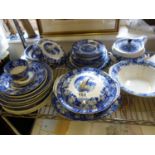 Large amount of Willow pattern blue and white china including tureens, lids, plates, and dinner