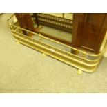 Decorative pierced brass fire front, with lion paw supports, 5' long with a galleried top