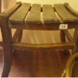 19 th century Pheasant pluckers stool, with slatted top, titled seating area on splay supports