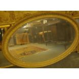 Oval gilt framed 19 th century mirror with bevelled edged glass 3'2" long x 24" tall