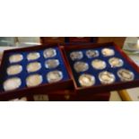 Presentation coin box containing 18 £5 SILVER coins each one with a coa, in collectors capsules,