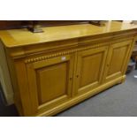 Modern good quality bleached oak sideboard with triple doors to the front all above blind drawers to