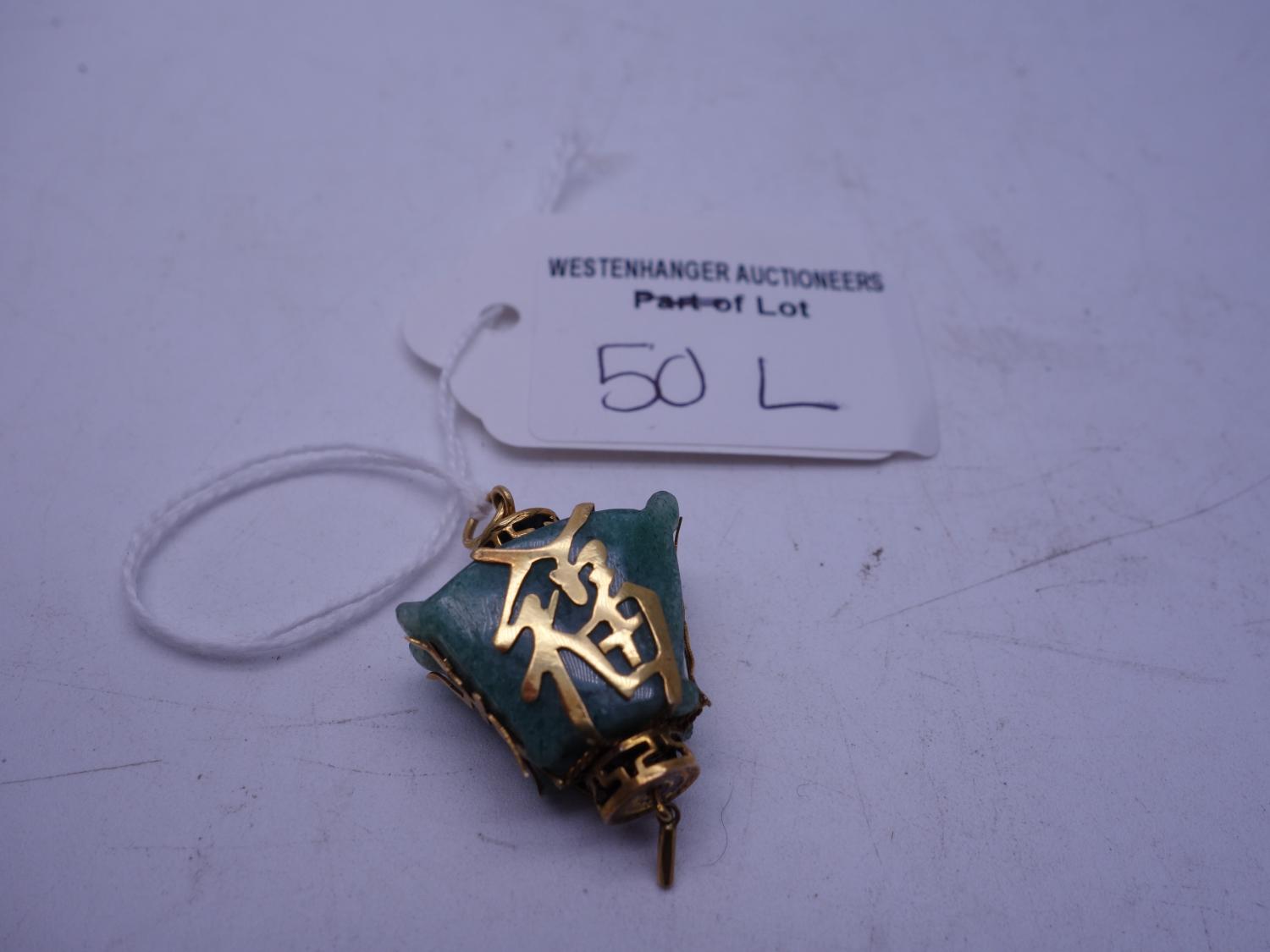 Oriental Chinese Jade and gold bound pendant, total weight 8.5 grams, the gold body pierced with