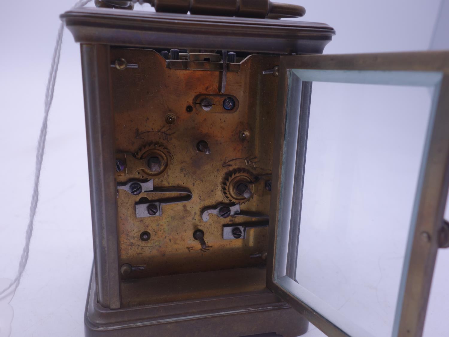 French early 20th century small travelling alarm clock with 4 glass sides, visible escapement to the - Image 4 of 4