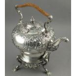 A silver spirit kettle, Daniel & John Wellby, London 1894, profusely decorated with foliage, the