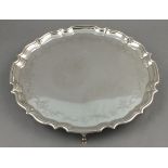 A silver salver, Barker Brothers, Chester 1907, circular with a pie-crust edge and foliate bright-