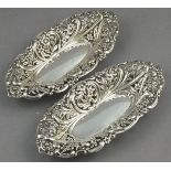 A pair of silver bonbon dish, Birmingham 1893, elongated oval form decorated with pierced foliage,