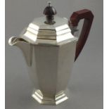 A silver hot water jug, Birmingham 1937, Aide Bros., of octagonal baluster form, 20cm high, 550gms