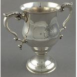 A silver twin handle cup, London 1772, Walter Brind, of baluster form, the twin handles with leaf