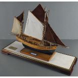 A 20th century table-top model of the Bretton cutter "Marie" fully rigged, with a blue painted hull,