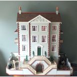 A 20th Century hand-crafted doll's house, constructed in the form of a Georgian house,  green
