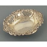 A silver bon bon dish, Birmingham 1961, with repousse floral decorated on and pierced lattice