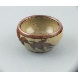 Jeremy LEACH & Robert TINNYUNT (circa 1970) a stoneware glazed salt, leaf decoration on a speckle