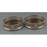 A pair of Georgian silver wine coasters, London 1800, Richard Cook, with pierced sides incorporating