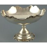 A silver tazza, London 1903, with a scalloped rim cast with foliage raised on a conforming base, 525