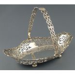 A swing handle silver basket, Sheffield 1904, William Hutton, of oval form with pierced foliate