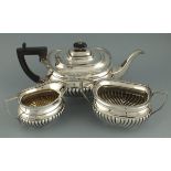 A three piece tea service, Sheffield 1912, Cooper Bros. & Sons, of rectangular form with part