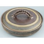 British 20th century pottery A large shallow dish and covered with rope-twist handle and speckled