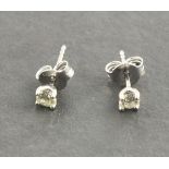 A pair of 18ct white gold diamond ear studs, total weight 1ct