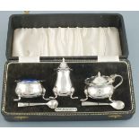 A sliver cruet set, Birmingham 1966, Angora Silver Co., with caldron sale and mustard raised on