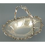 A silver swing-handle basket, Sheffield 1902, Walker & Hall, of oval form with a foliate border