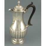 A sliver hot water jug, London 1899, Charles Stuart Harris, of baluster form and part fluted body,
