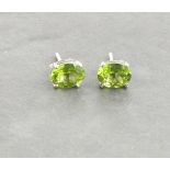 A pair of peridot ear studs