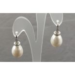 A pair of 18ct white gold cultured freshwater pearl and diamond drop earrings, total diamond carat