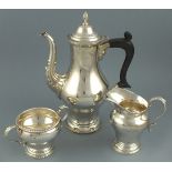 A silver coffee service, Birmingham 1973, Baker Ellis, of plane baluster form with leaf capping