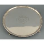 A circular silver salver, London 1787, Elizabeth Jones, with a beaded rim, the centre engraved